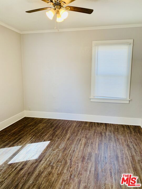 219 East 10th Street Long Beach, CA 90813 - Photo 22 of 26 a view of an empty room with wooden floor and a window