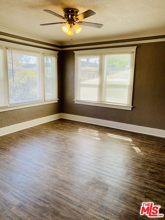 219 East 10th Street Long Beach, CA 90813 - Photo 24 of 26 a view of an empty room with wooden floor and a window