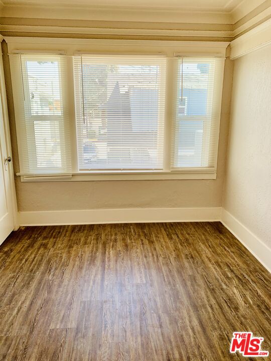 219 East 10th Street Long Beach, CA 90813 - Photo 25 of 26 a view of a room with wooden floor and a window