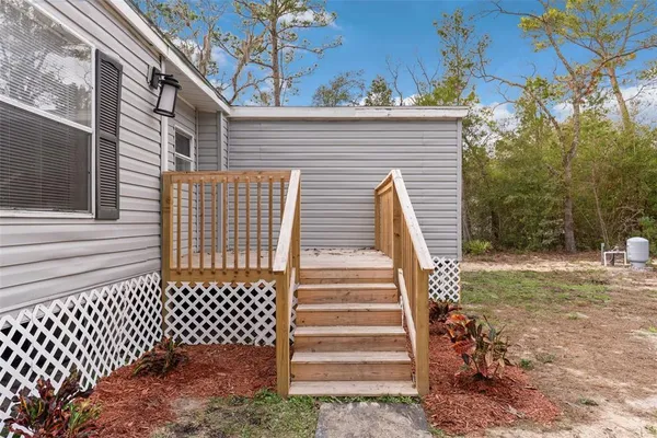 a view of a back yard of the house