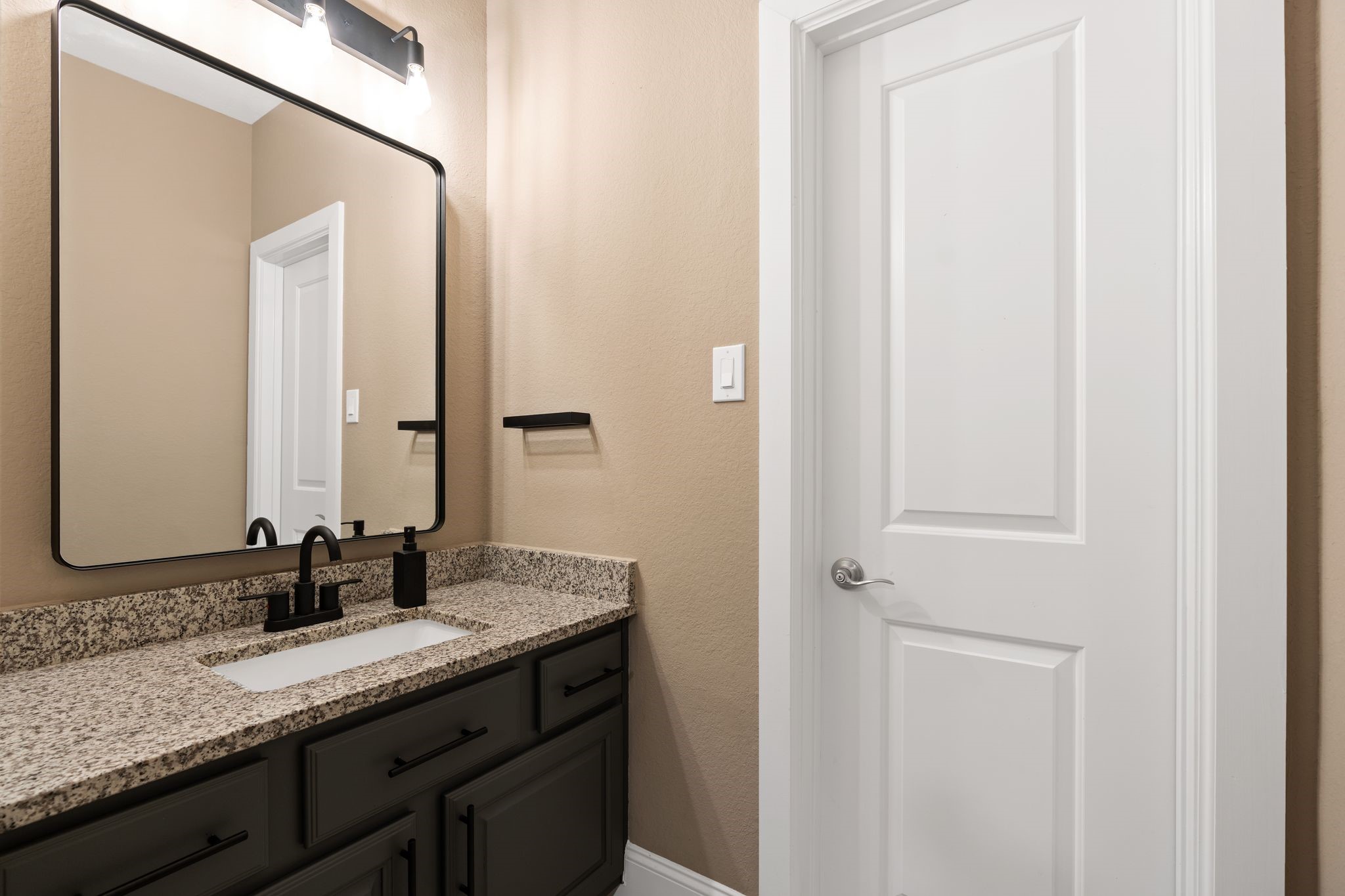 2914 Rutherford Pl Court Katy, TX 77494 - Photo 45 of 50 a bathroom with a granite countertop sink and a mirror