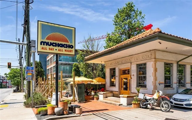 a view of a house with lake outdoor seating area and furniture