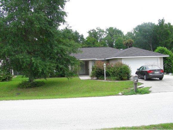 72 Hickory Loop Way Ocala, FL 34472 - Photo 1 of 1 a house view with a garden space