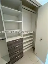 a view of storage and utility room with racks on the wall