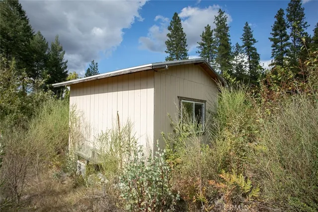 a view of a backyard of the house
