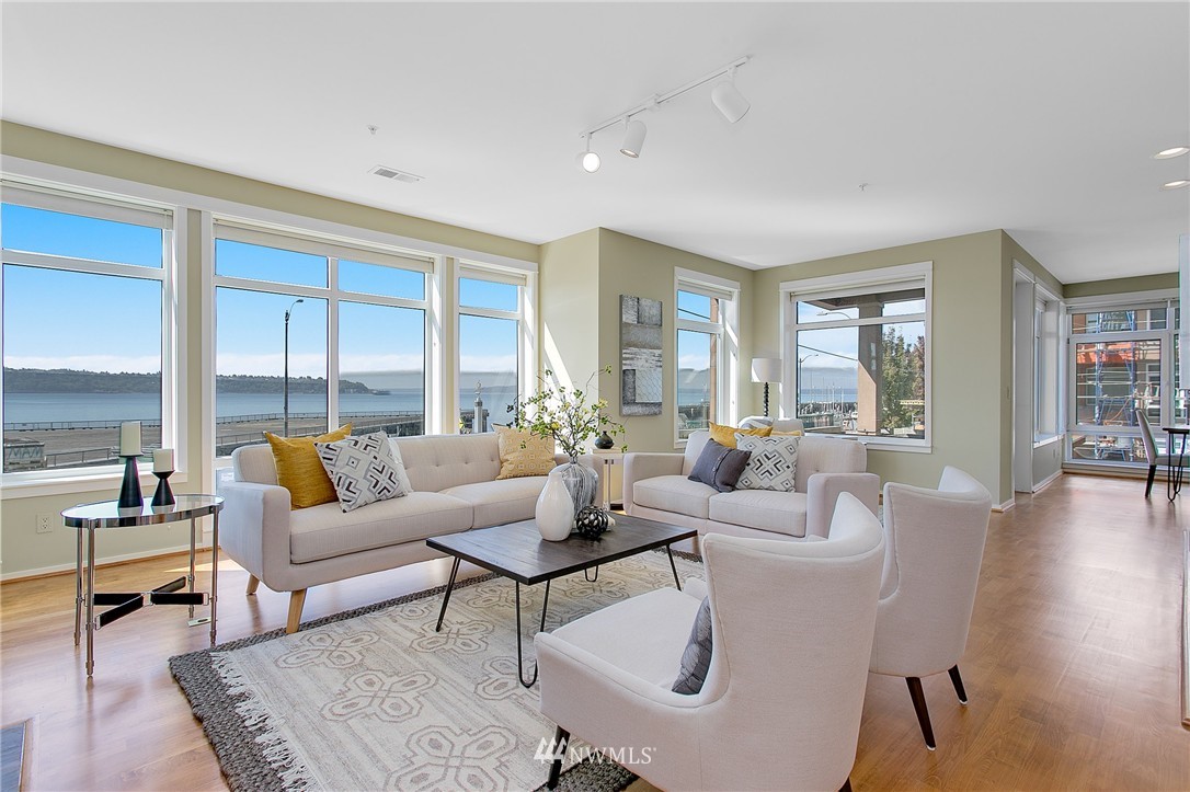 1950 Alaskan Way, Unit 237 Seattle, WA 98101 - Photo 1 of 20 a living room with furniture and a large window
