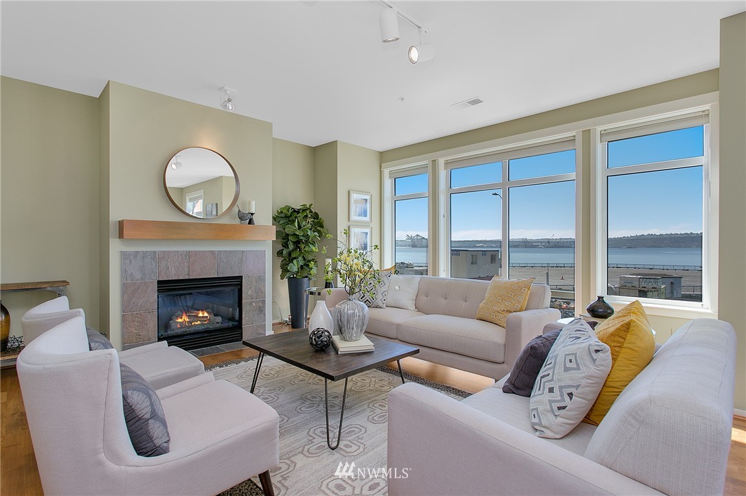 1950 Alaskan Way, Unit 237 Seattle, WA 98101 - Photo 2 of 20 a living room with furniture and a fireplace