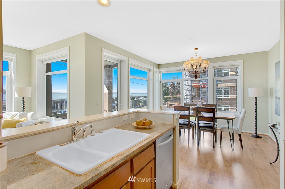 1950 Alaskan Way, Unit 237 Seattle, WA 98101 - Photo 7 of 20 a view of a dining room with furniture window and outside view