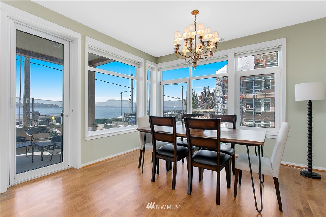 1950 Alaskan Way, Unit 237 Seattle, WA 98101 - Photo 9 of 20 a view of a dining room with furniture window and wooden floor