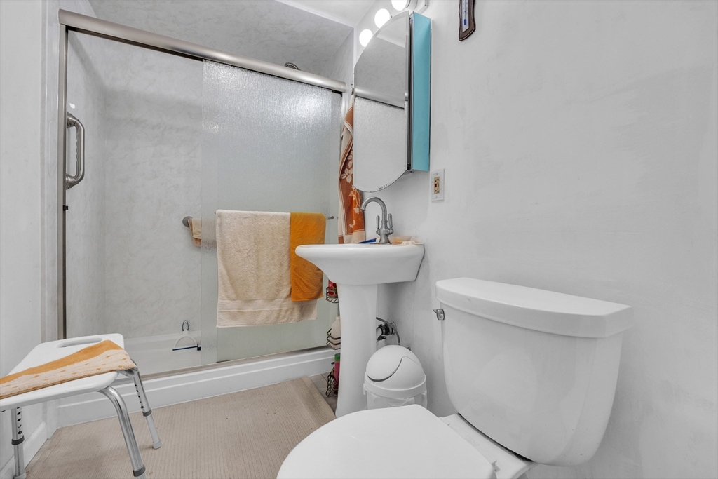 228 Walnut Hill Road Orange, MA 01364 - Photo 13 of 20 a bathroom with a sink toilet and shower