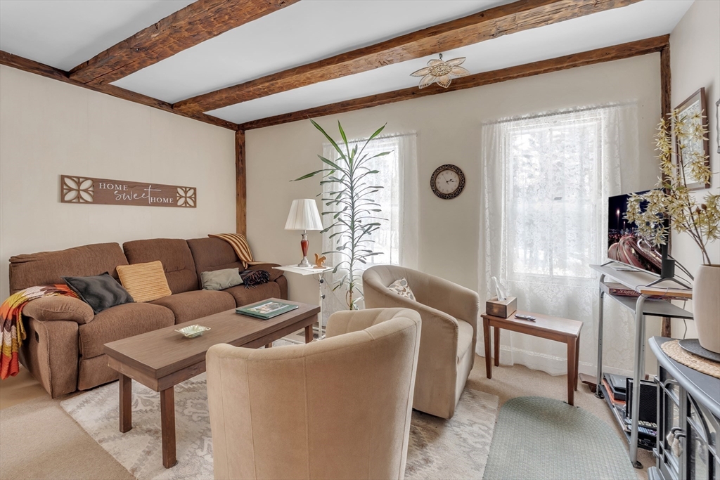 228 Walnut Hill Road Orange, MA 01364 - Photo 2 of 20 a living room with furniture and a window