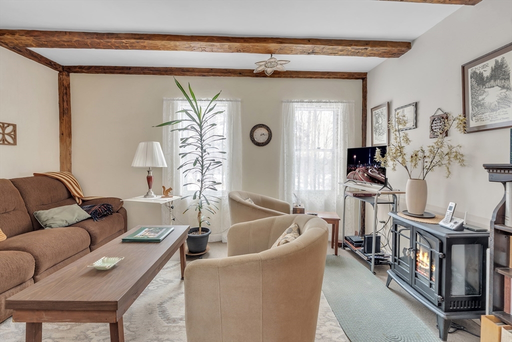 228 Walnut Hill Road Orange, MA 01364 - Photo 3 of 20 a living room with furniture and a flat screen tv
