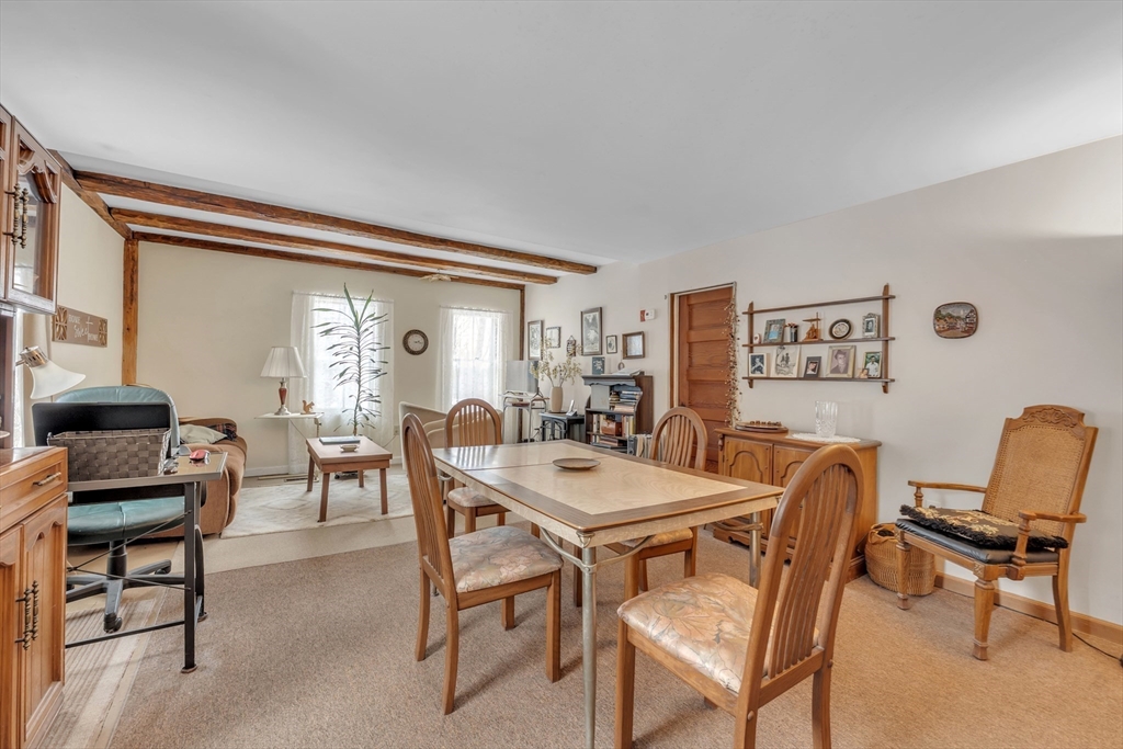 228 Walnut Hill Road Orange, MA 01364 - Photo 4 of 20 a view of a dining room with furniture and a window