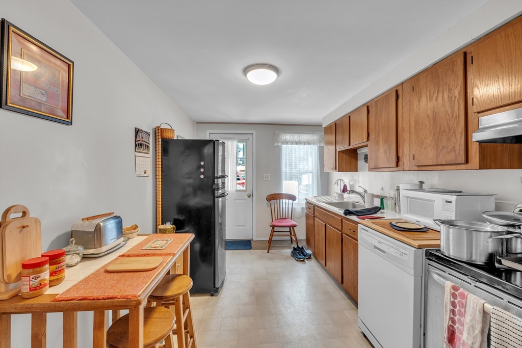 228 Walnut Hill Road Orange, MA 01364 - Photo 7 of 20 a kitchen that has a lot of cabinets a sink and appliances in it