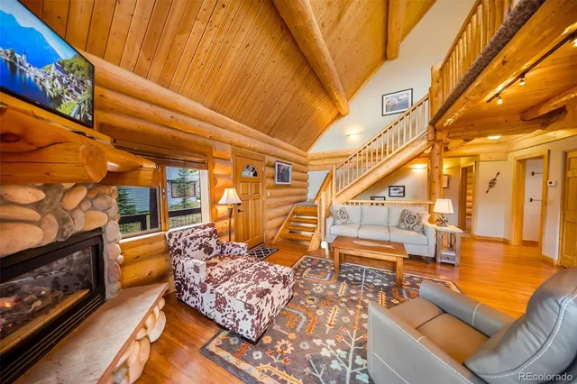 a bedroom with furniture and a fireplace