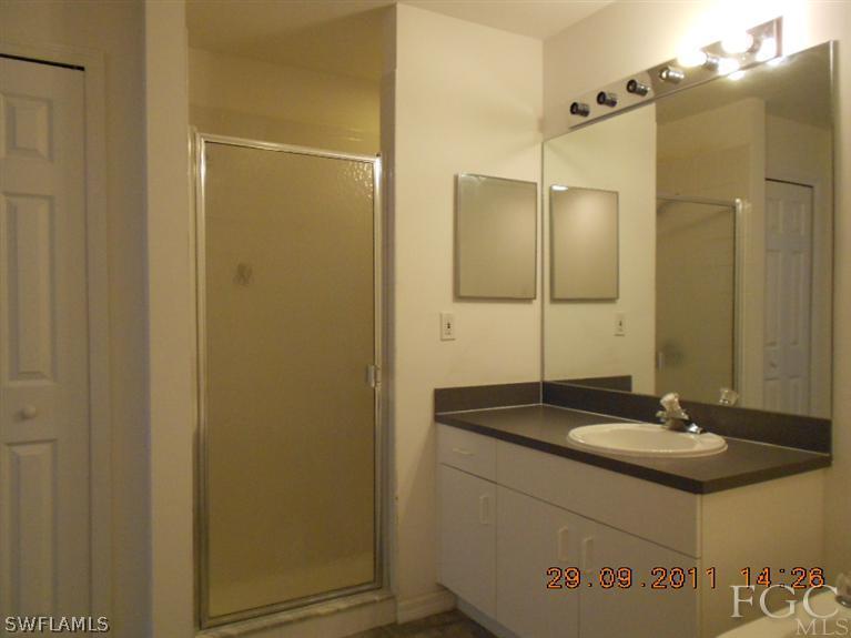 217 Rue Labonne Road Fort Myers, FL 33913 - Photo 5 of 8 a bathroom with a sink and a mirror