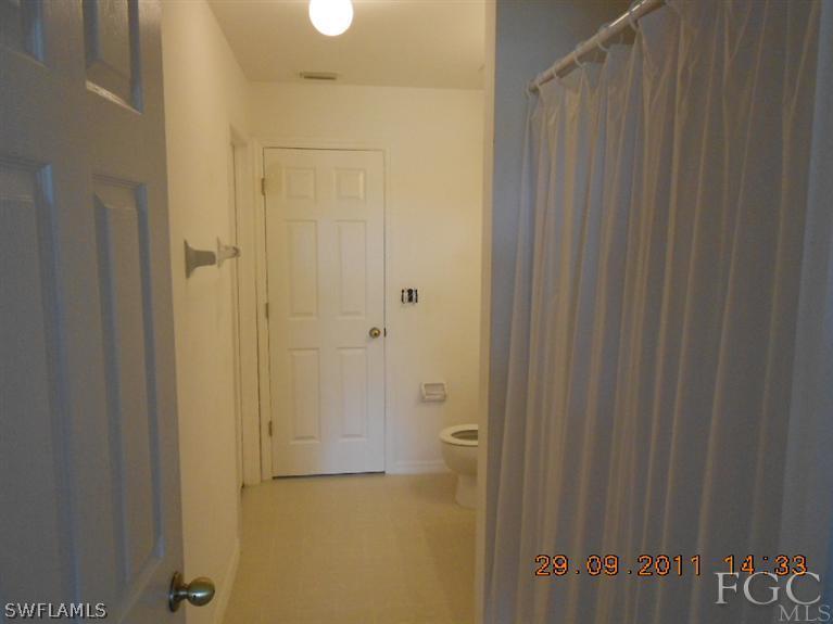 217 Rue Labonne Road Fort Myers, FL 33913 - Photo 7 of 8 a bathroom with a shower