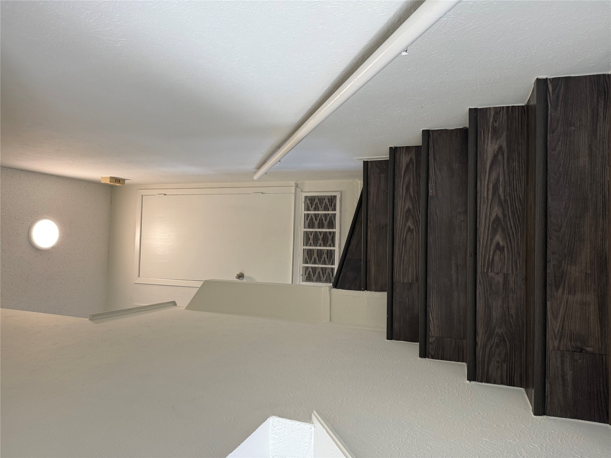 11807 Alpheus Avenue, Unit B Austin, TX 78759 - Photo 11 of 16 Staircase featuring a textured wall