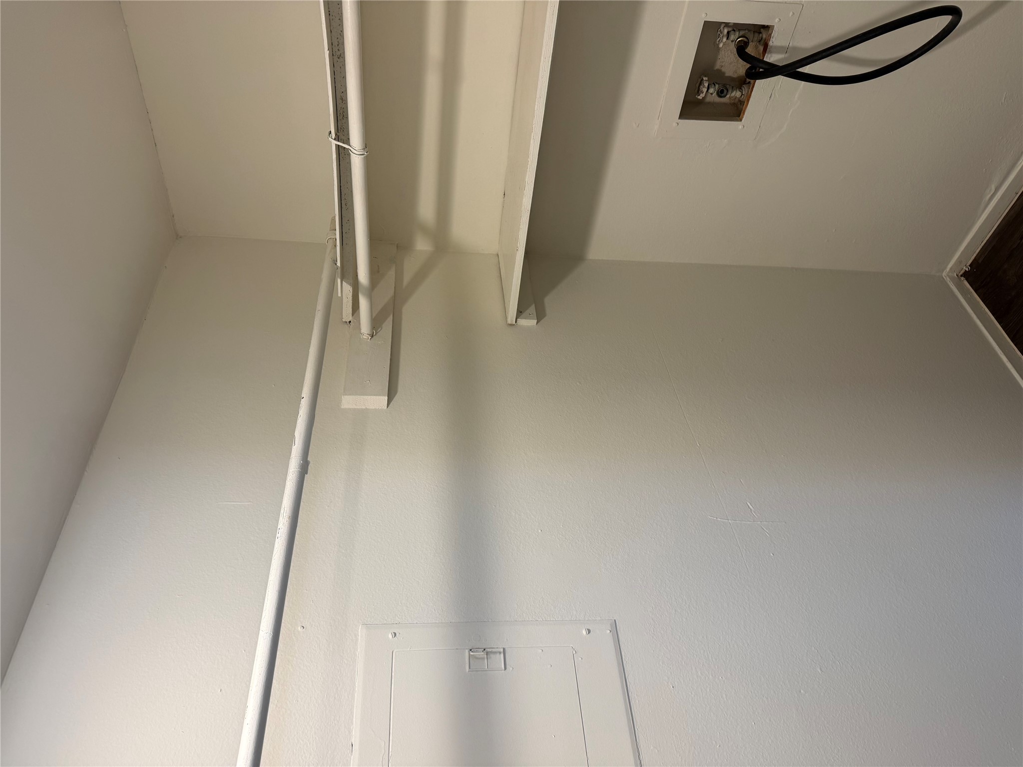 11807 Alpheus Avenue, Unit B Austin, TX 78759 - Photo 9 of 16 Laundry area with electric panel, hookup for a washing machine, and dark wood finished floors