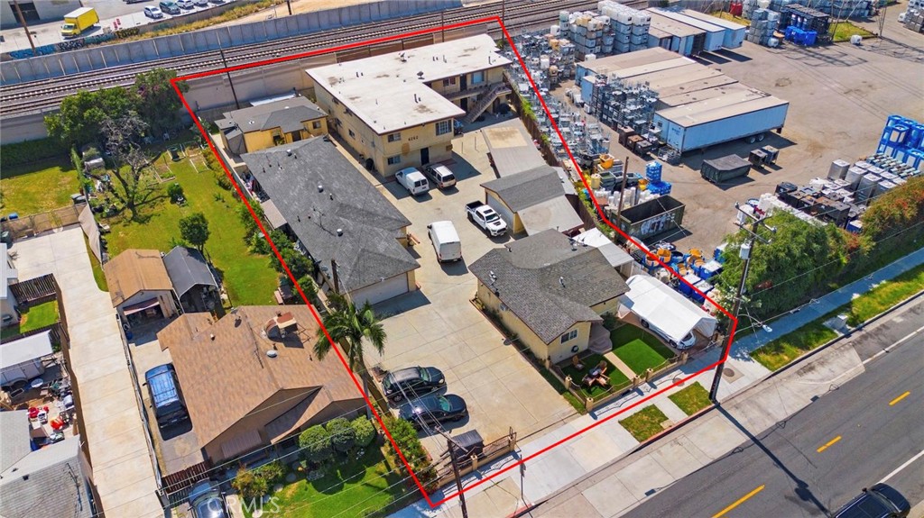 6260 Ferguson Drive Commerce, CA 90022 - Photo 24 of 28 an aerial view of a residential apartment building with plants and large trees