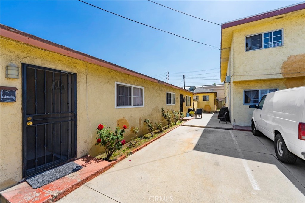6260 Ferguson Drive Commerce, CA 90022 - Photo 3 of 28 a view of a house with a cars park side of a road