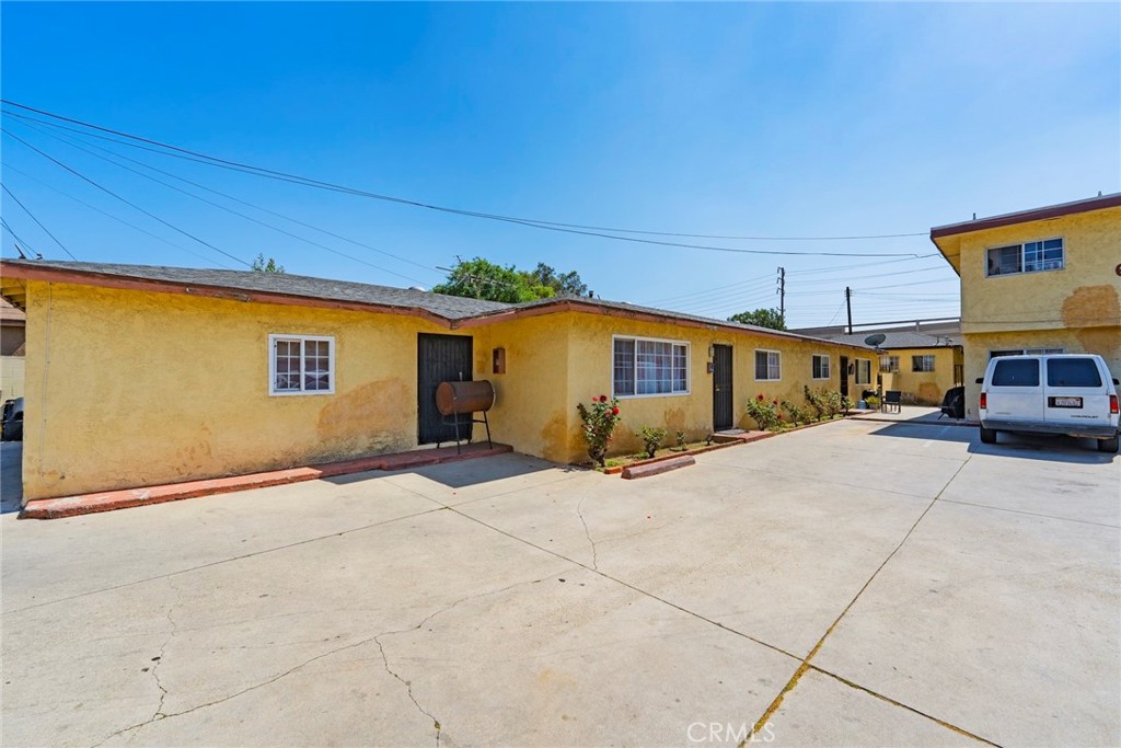 6260 Ferguson Drive Commerce, CA 90022 - Photo 9 of 28 a front view of a house with a road