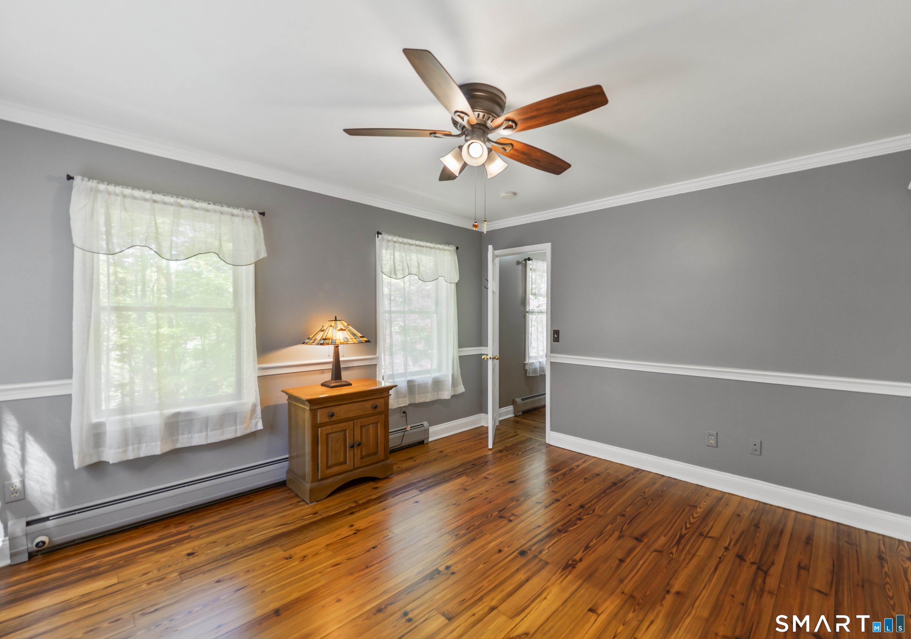 18 Gelding Hill Road Newtown, CT 06482 - Photo 33 of 40 an empty room with wooden floor fan and windows