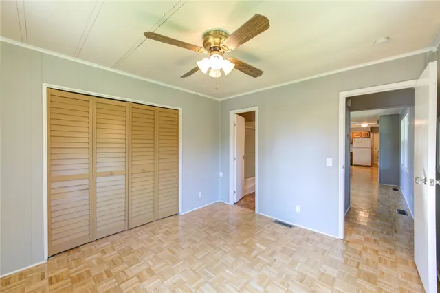 a view of a livingroom with a ceiling fan and a ceiling fan