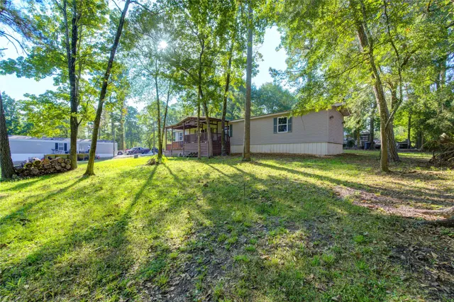 a view of a backyard with a small cabin