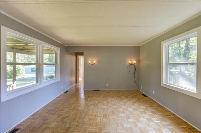 a view of an empty room with a window