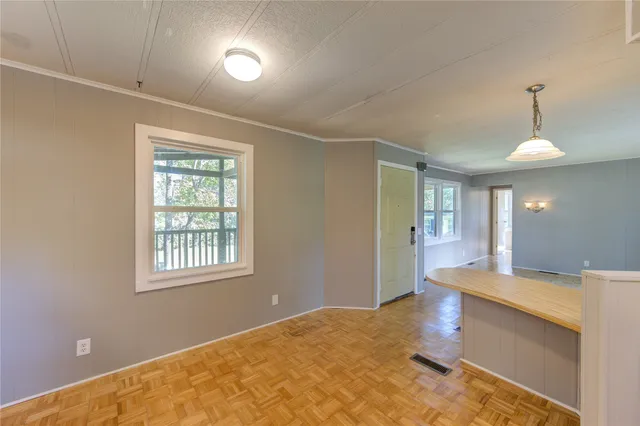 a view of an empty room with a window