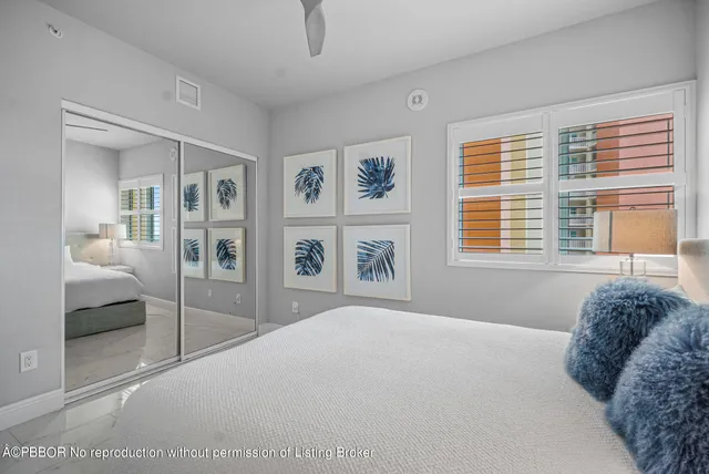 a spacious bedroom with a large bed and a window