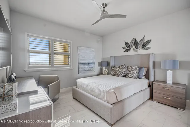 a bedroom with a large bed and a couch