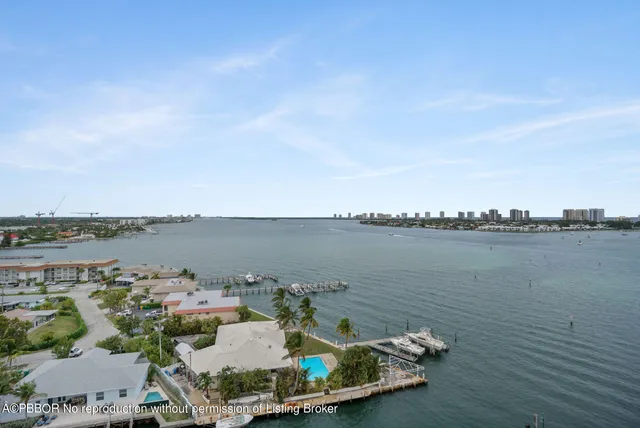 a view of a lake with houses in the back