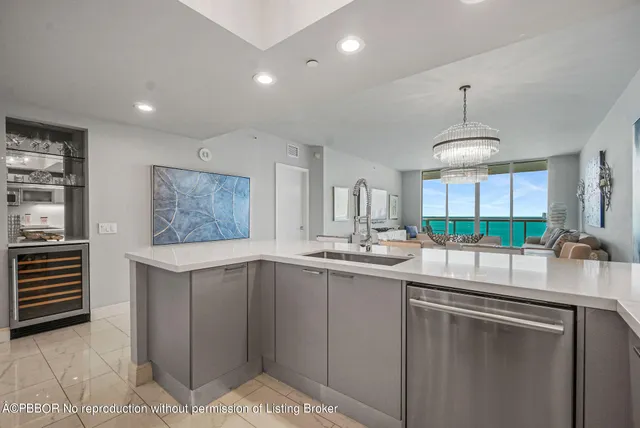 a kitchen with a sink stainless steel appliances and cabinets