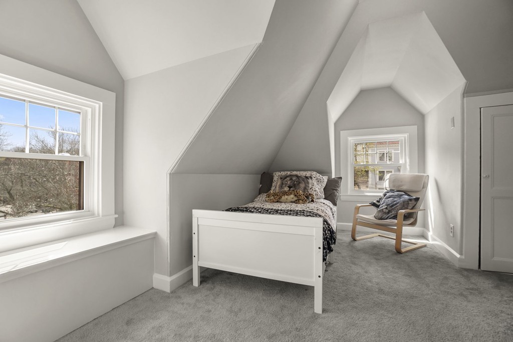 655 Washington Street, Unit 655 Brookline, MA 02446 - Photo 19 of 26 a living room with furniture and a window