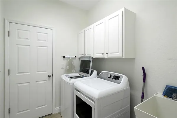 a bathroom with a toilet a sink and shower