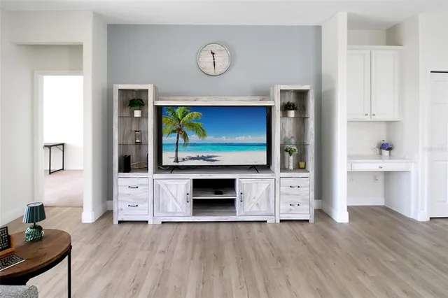 a view of a living room and a window with balcony
