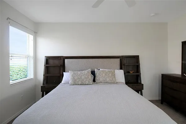 a bath tub sitting in a bathroom next to a window