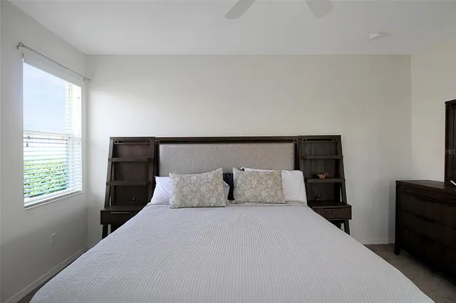 a bath tub sitting in a bathroom next to a window