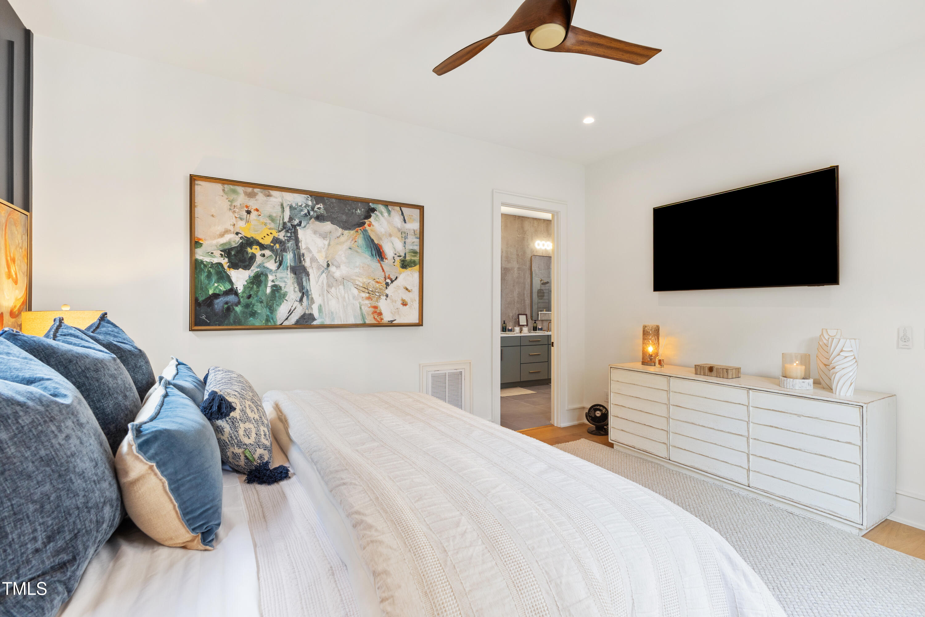 1625 Bruce Circle Raleigh, NC 27603 - Photo 33 of 63 a bedroom with a large bed and a flat screen tv