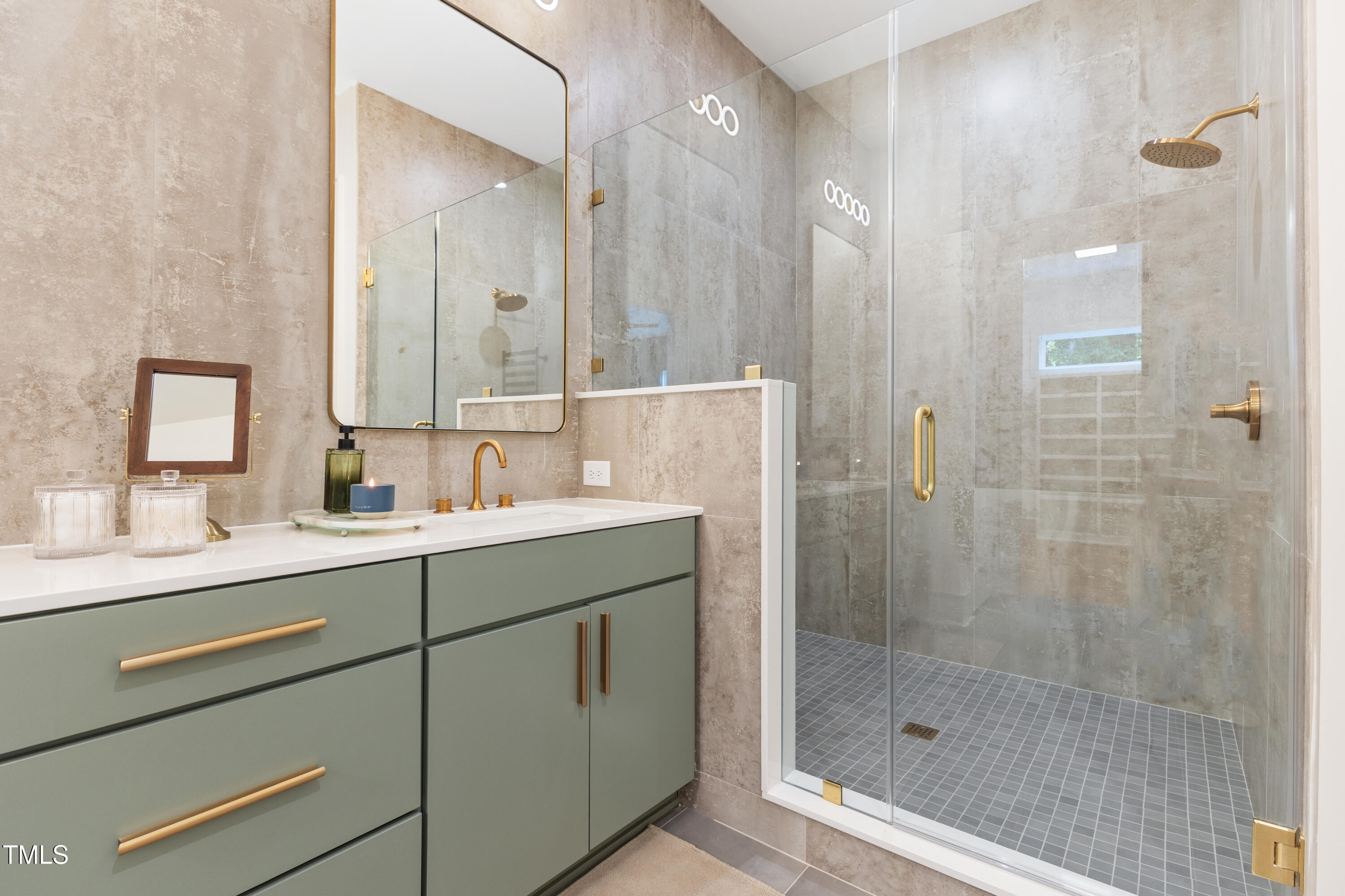 1625 Bruce Circle Raleigh, NC 27603 - Photo 35 of 63 a bathroom with a shower sink and mirror