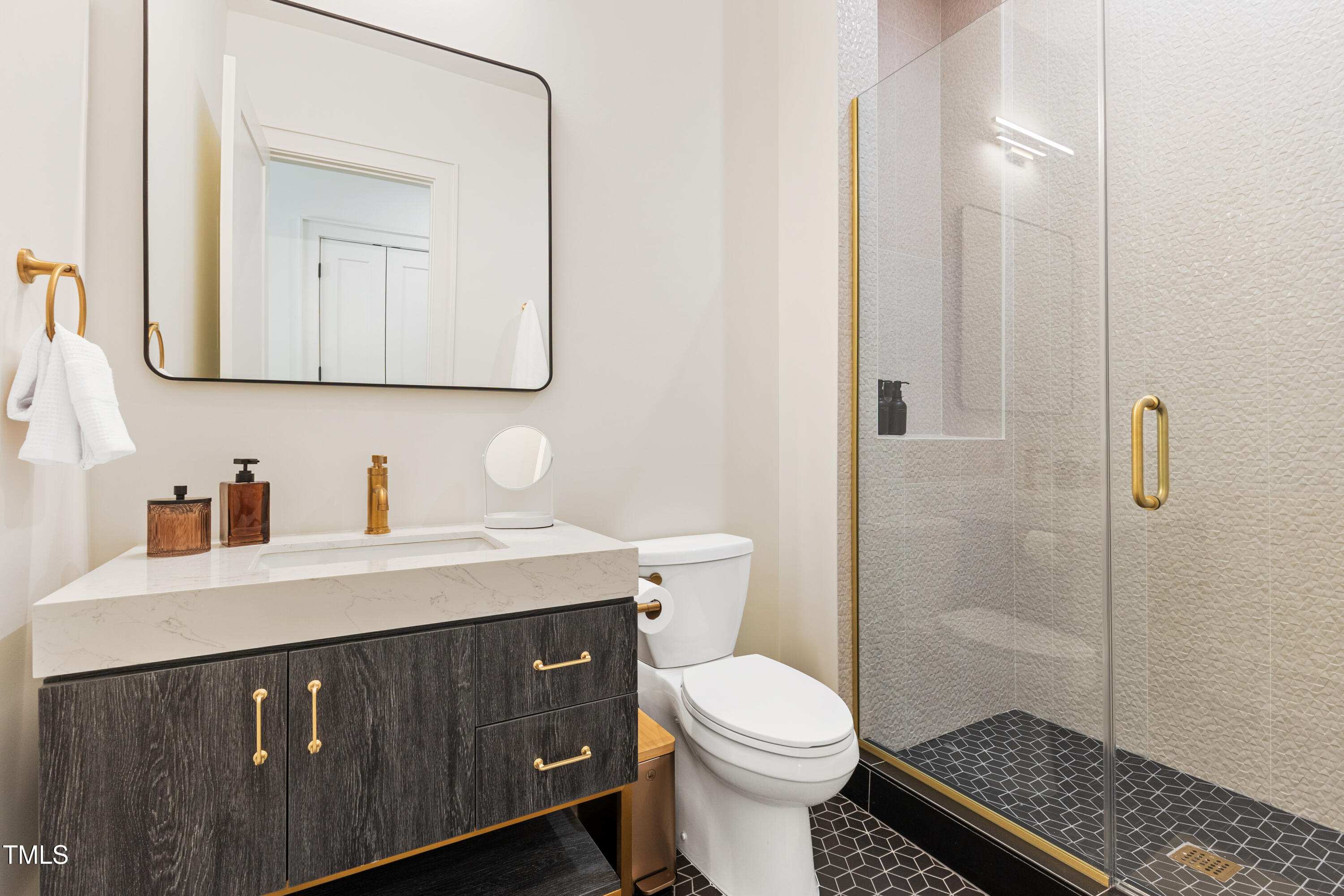 1625 Bruce Circle Raleigh, NC 27603 - Photo 44 of 63 a bathroom with a sink a toilet and shower