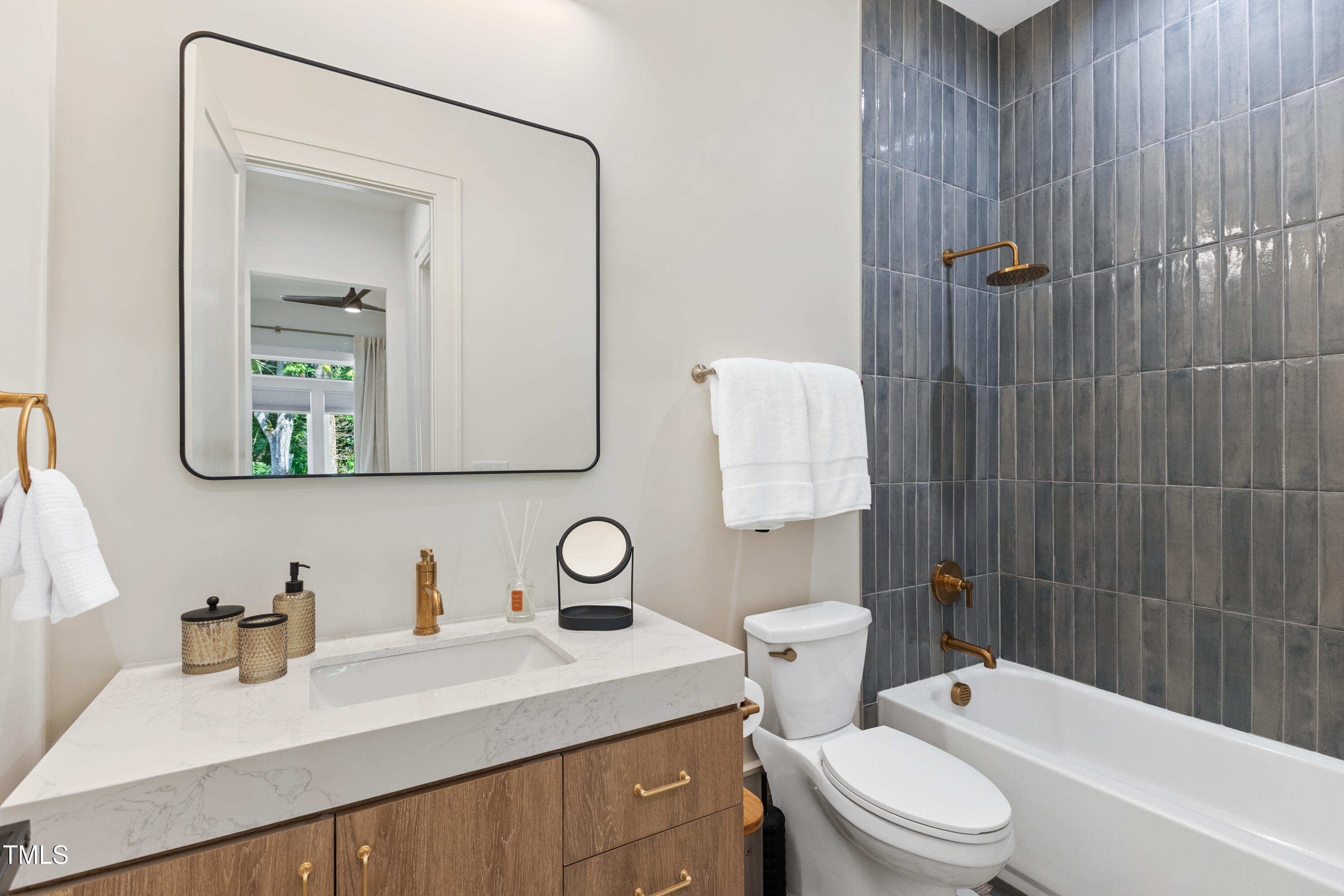 1625 Bruce Circle Raleigh, NC 27603 - Photo 47 of 63 a bathroom with a sink toilet vanity and shower