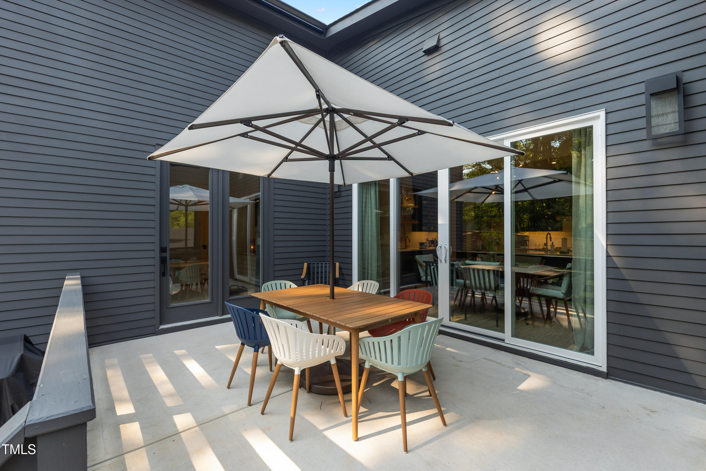 1625 Bruce Circle Raleigh, NC 27603 - Photo 51 of 63 a patio with a table and chairs and potted plants