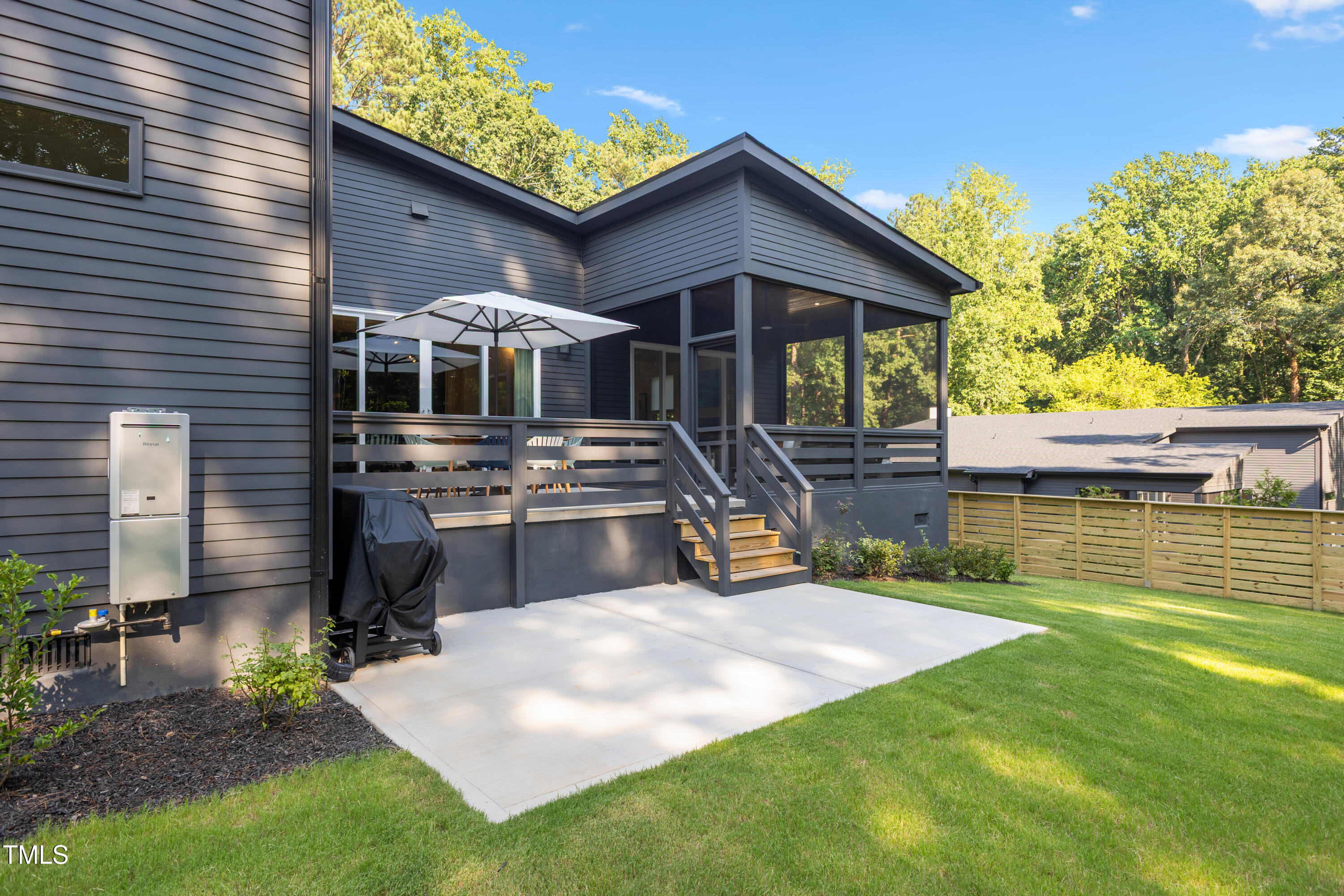 1625 Bruce Circle Raleigh, NC 27603 - Photo 54 of 63 a front view of a house with a yard table and chairs