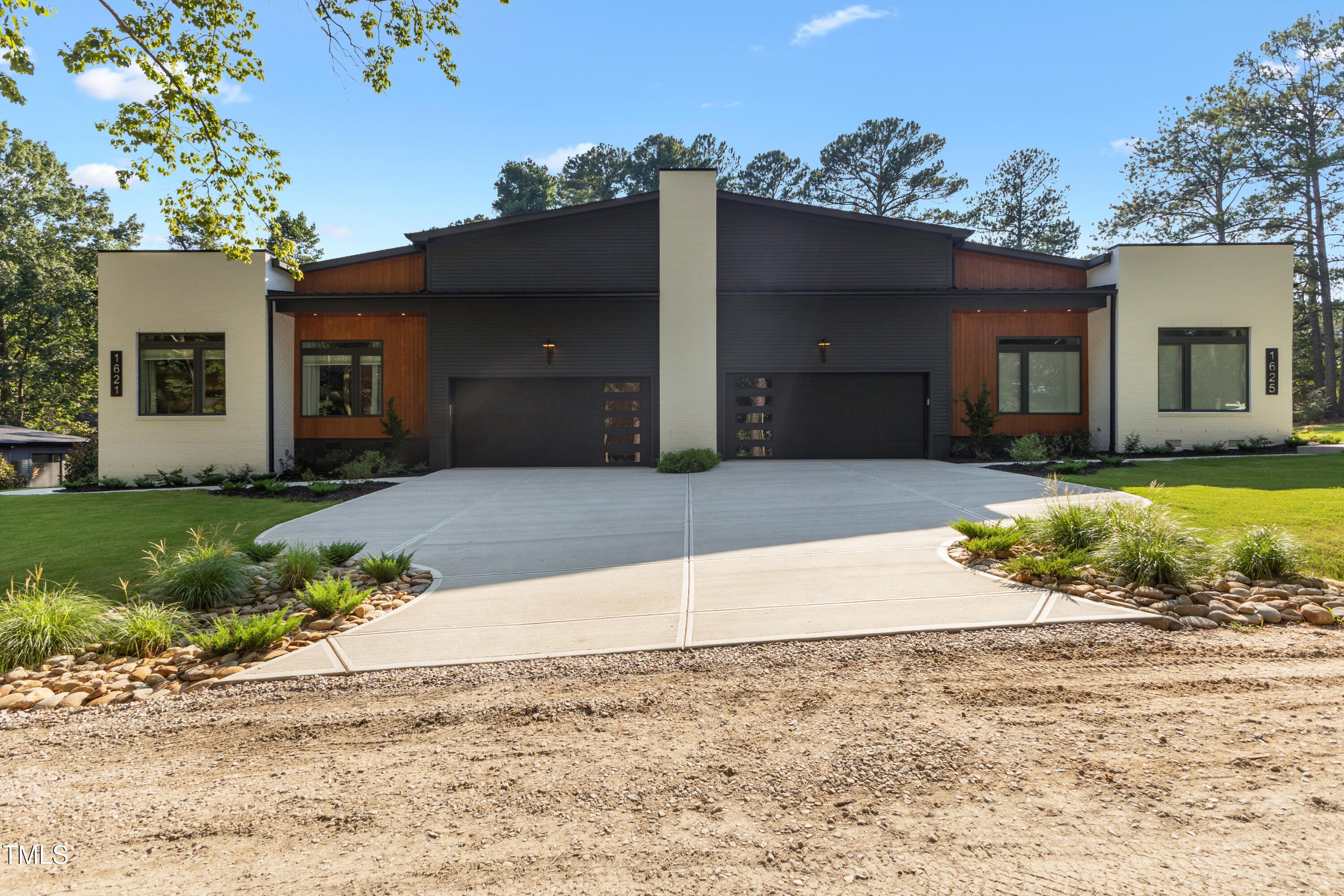 1625 Bruce Circle Raleigh, NC 27603 - Photo 63 of 63 a front view of a house with a yard and potted plants