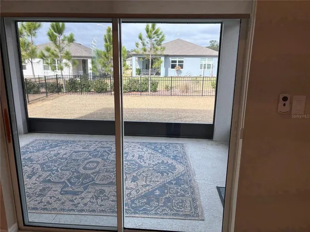 a view of a balcony with a potted plants