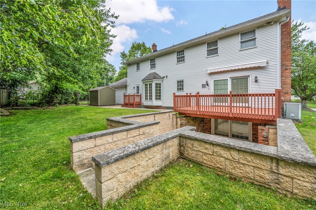 38814 Johnnycake Ridge Road Willoughby, OH 44094 - Photo 44 of 48 Rear view of house with a chimney and a deck