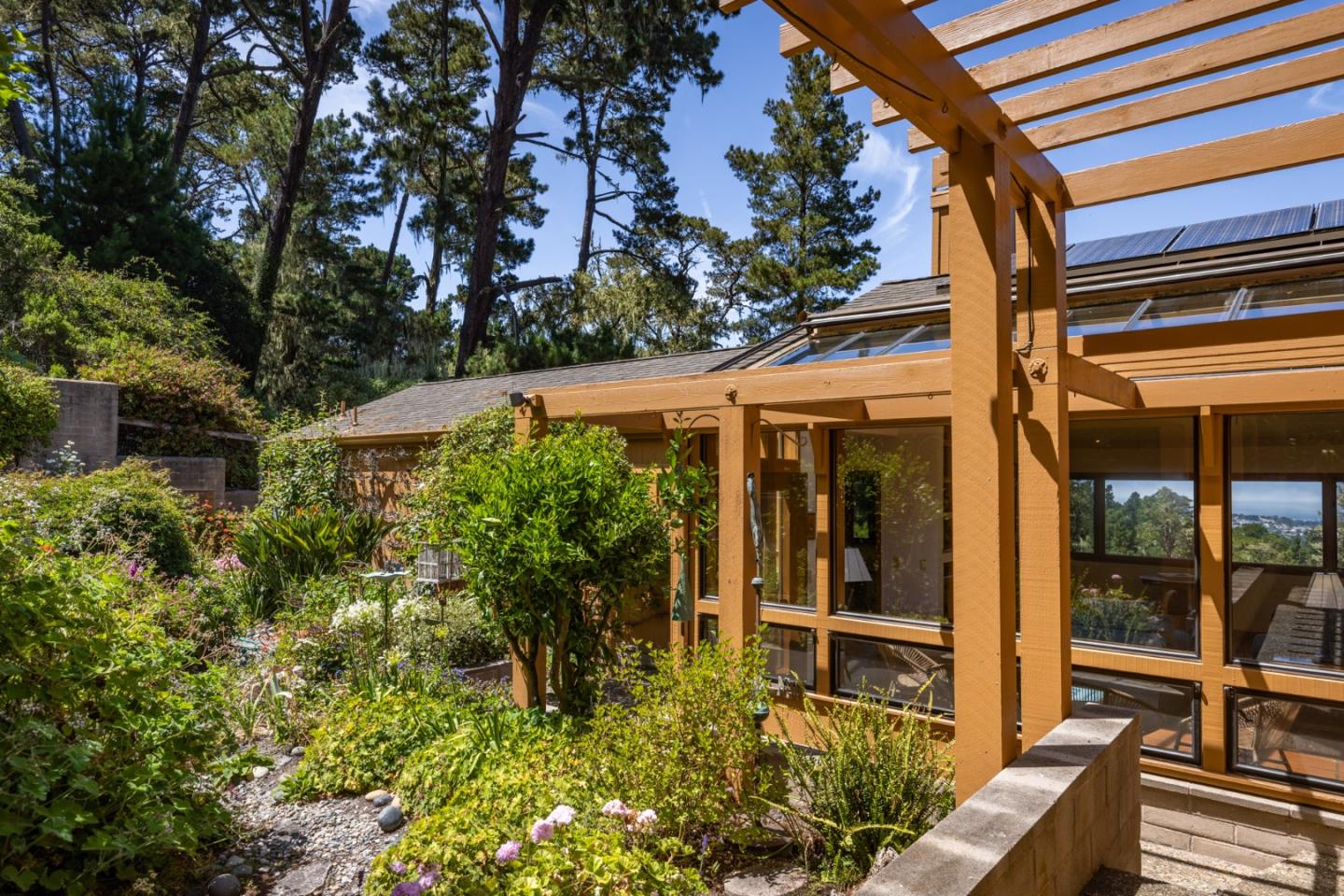 540 Aguajito Road Carmel, CA 93923 - Photo 19 of 32 an outdoor view of garden with patio